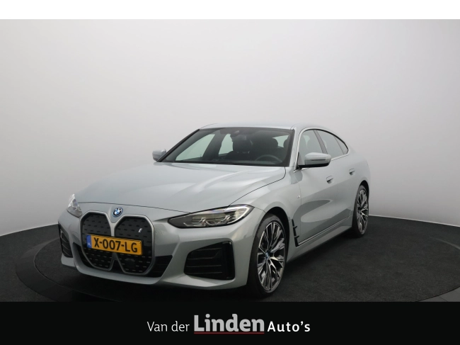 BMW i4 - eDrive40 84 kWh M-Sportpakket SOH 97,4% | Brooklyn Grau | Live Cockpit Plus | Leer